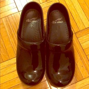Dansko black patent leather clogs